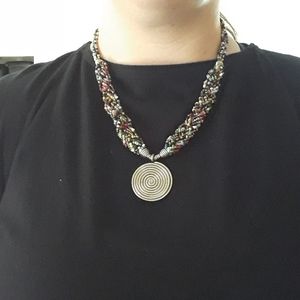 Multicolored handed beaded necklace with spiral